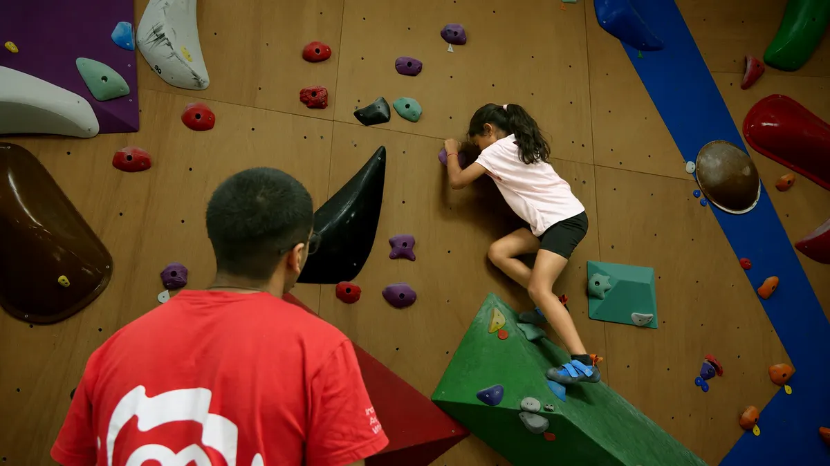Children learning to climb in the Summit Squad programme at Equilibrium